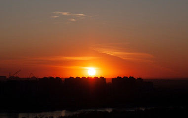 Scarlet sunset in autumn city 