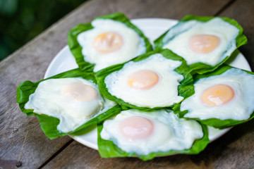 cooking fried egg for breakfast