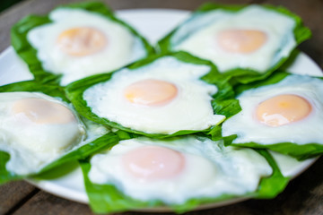 cooking fried egg for breakfast