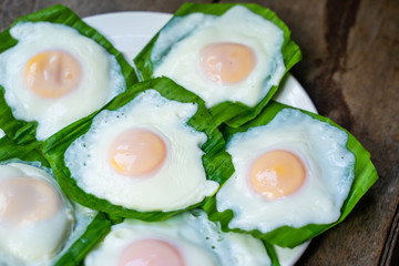 cooking fried egg for breakfast