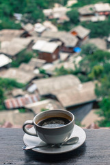 cup of coffee on wooden table