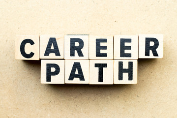 Letter block in word career path on wood background