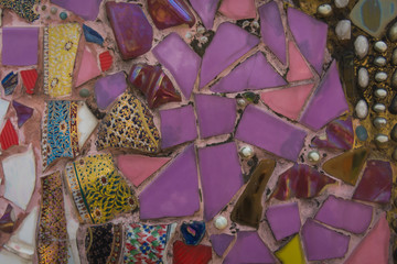 The temple walls are made of broken glass and broken tiles.