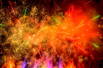 Colorful fireworks exploding on black night sky