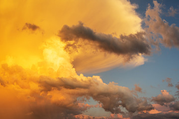 Clouds and sky at sunrise and sunset, orange and red colors.