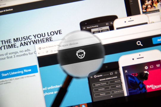 Napster web page under magnifying glass.