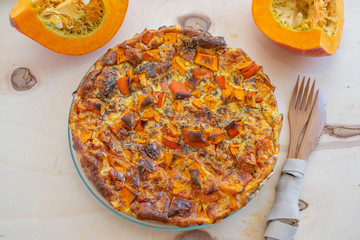 home made pumpkin quiche lorraine on a table