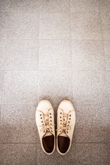 White leather shoes on tiles flooring