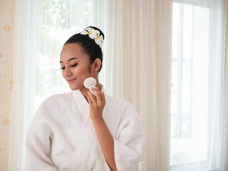 Asian women use herbal compresses to the face. Health spa, Thai massage