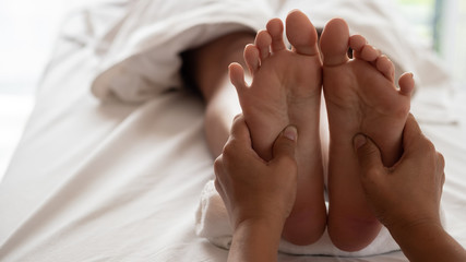 Obraz na płótnie Canvas Close-up Foot massage in spa salon