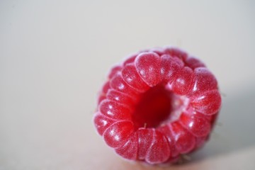 bright scarlet raspberry on light background