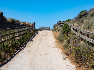 Fototapeta na wymiar Road at Bechers Bay Pier on a sunny spring day, Santa Rosa Island, Channel Islands National Park, Ventura, California, USA