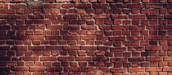 Brick wall in the sunlight. Vintage architectural texture background