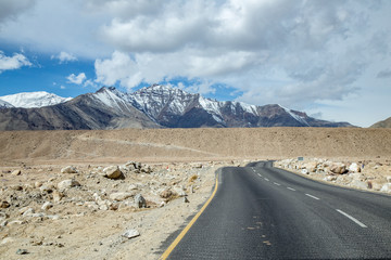 Leh Manali Highway road on magnetic field in Leh Ladakh area, Jammu and Kashmir, India with heaven snow mountian of Beautiful Himarayan panorama view.