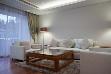 Panoramic view of nice light living room.