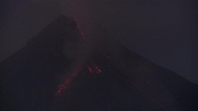 Lava Pours From Erupting Mayon Volcano At Night