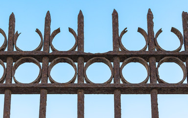 closeup detail of an antique rusting wrought iron fence at the old train station in Tel Aviv Israel...