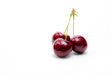 Red cherry with stalk isolated on white background. Ripe red sweet cherry. Sweet and juicy organic...