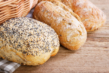 Buns and breads on breakfast table.