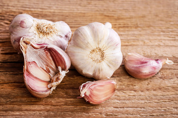 Garlic on brown wooden table.