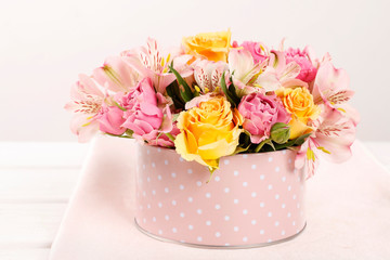 Woman shows how to make floral arrangement