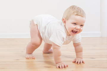 funny little  baby on wooden floor