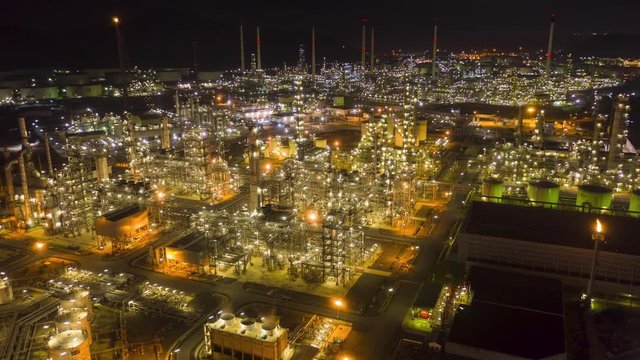 Hyperlapse Timelapse Aerial view night light oil refinery terminal is industrial facility for storage of oil and petrochemical. oil manufacturing products. power electric plant. footage video 4k.