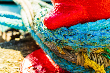 Harbor marina detail. Old rusty mooring bollard with rope. Berth in the passenger port. Mooring...