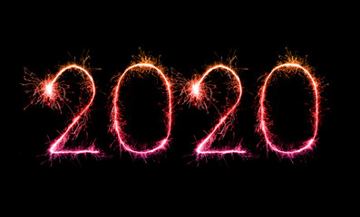 2020 happy new year fireworks written sparklers at night