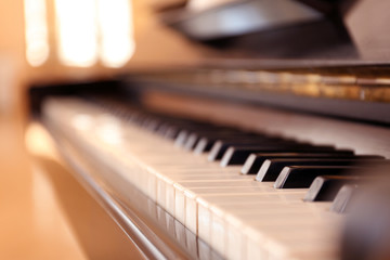 Black and white piano keys indoors, closeup