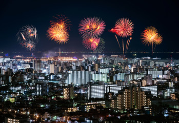 Fireworks over Tokyo cityscape at night, Japan