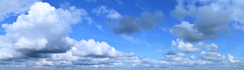 Summer cloudy sky. Horizon, moisture-bearing and vapor-forming atmospheric phenomenon, panoramic image.
