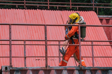 Firefighters save children from high places in a fire accident.