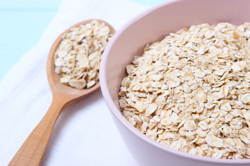 Raw oatmeal long cooking on the table.