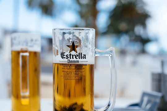 Two jars of cold Estrella Damm beer