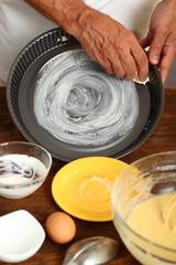 Making Sour Cream Lemon Cake. Preparing Cake Pans For Baking. Greasing with margarine or butter.