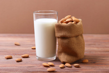 Almond milk and almonds on the table. Vegetable milk. Vegetarian milk.