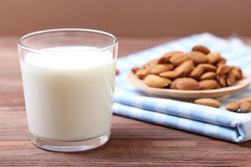 Almond milk and almonds on the table. Vegetable milk. Vegetarian milk.