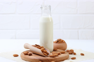 Almond milk and almonds on the table. Vegetable milk. Vegetarian milk.