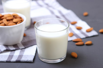 Almond milk and almonds on the table. Vegetable milk. Vegetarian milk.