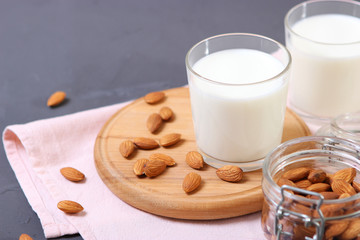 Almond milk and almonds on the table. Vegetable milk. Vegetarian milk.