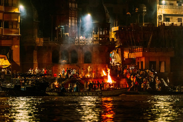 The burning bodies ceremony at holy Dasaswamedh Ghat, near Kashi Vishwanath Temple while raining at...