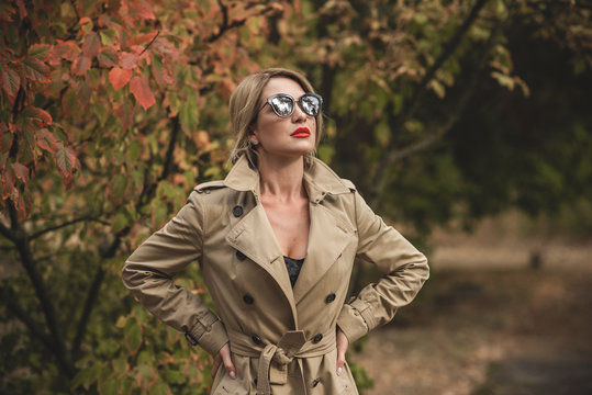 Woman At Autumn In Fashionable Beige Coat, Vogue And Clothes Concept