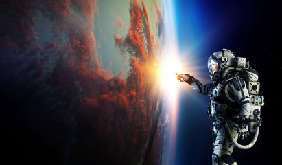 Astronaut and planet, human in space concept