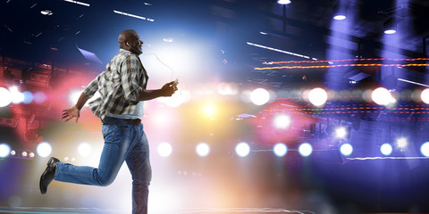 Black man in casual clothes in motion