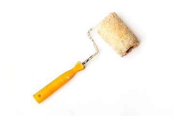 Used and dirty roller paint brush isolated on white background