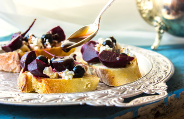 Appetizing bruschetta.Traditional italian bruschetta.Open sandwich with cottage and beetroot