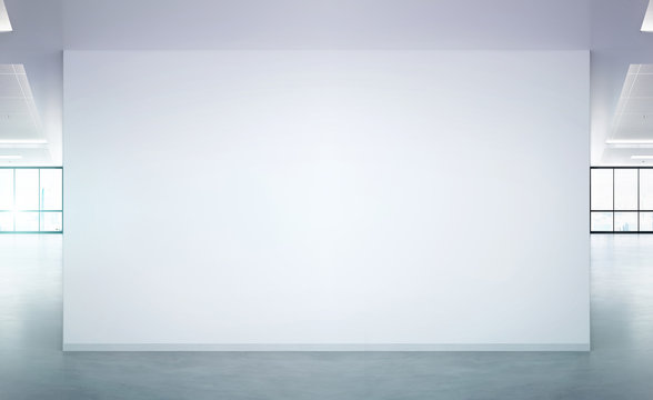 Blank wall in bright office mockup with large windows and sun passing through 3D rendering