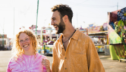 Friends laughing at the funfair