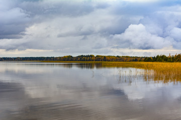 Calm water of the lake under the clouds
